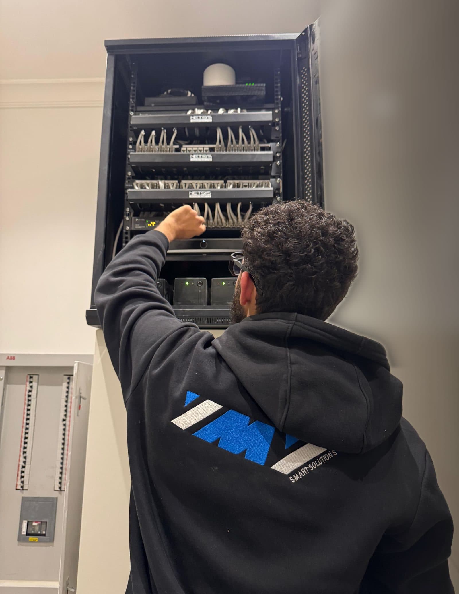 YMY technician at an equipment rack